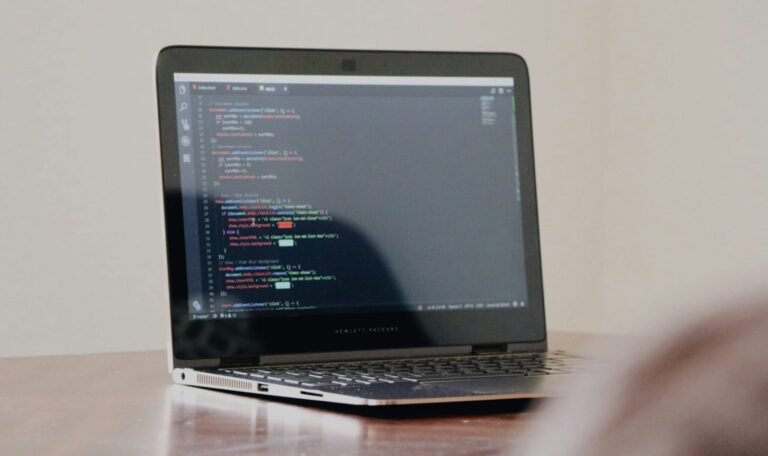 Laptop showing code during a content analysis and editorial review workflow
